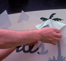 The unveiling: slowly pull the liner toward you and down to reveal your letters and graphics.