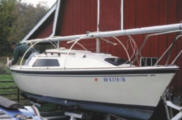 With the PVC pipes spanning the boat’s beam from stanchion base to opposite stanchion base, the effect resembles the hoops of a covered wagon and provides the skeletal frame for the tarp covering.