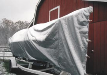 The tarp has been sized not only to cover the boat from stem to stern, but also from waterline to waterline, leaving only last season’s bottom paint exposed to the elements.