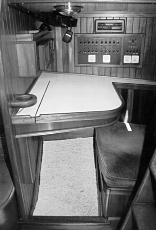 A mahogany navigation table replaced a large refrigerator on the starboard side. Tongue-and-groove strip paneling gives the boat’s inner space a beautiful custom-finished look.