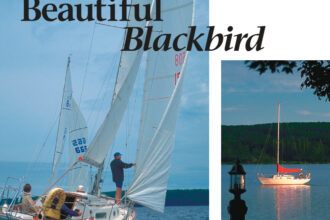 Blackbird, above, is part of the scenery at the Leonards’ home. At left, she races on Portage Lake not far from her mooring.