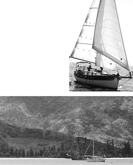 James and Cita Barry’s Gypsy Queen at top right and Bob Kaden’s Kuuipo in Hanalai Bay, Hawaii. About that bowsprit, Tom Walker says, “It’s quite easy to go out on it when necessary (which is seldom).”