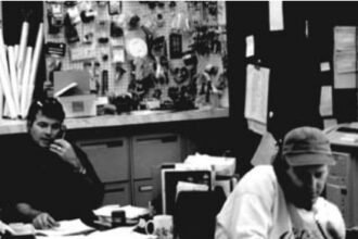 Rob MacLachlan, left, and Steve Kiemele, right, work the phones at South Shore Yachts.