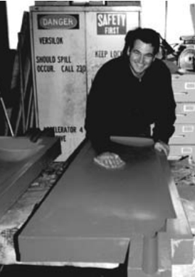 Rob waxes a rudder mold.