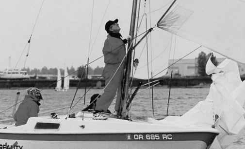 Steve Rander’s Cal 20, Reality Check, started the Portland Cal 20 fleet. Steve bought the boat when it was to be scrapped by a fellow who wanted just the mast. Steve gave him another mast in exchange and went on to start something big in Portland. In the photo at left, Steve’s at the helm, Lynne Hemmert is adjusting the spinnaker, and Todd Johnson is hidden from view.