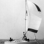 Catalina 22, hull #1, sails in the One of a Kind Regatta on Lake Michigan in 1970. The crew, from left: Rod Mortenson, Beattie Purcell, Lee Buffum, and Herbie Mortenson.