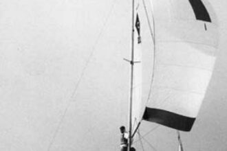 Catalina 22, hull #1, sails in the One of a Kind Regatta on Lake Michigan in 1970. The crew, from left: Rod Mortenson, Beattie Purcell, Lee Buffum, and Herbie Mortenson.