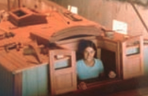 Laurie, in the hatchway of their nearly completed boat.
