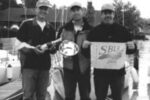 Doug Axtell is holding the silver, center, with friends Don Boesel, at left, and Kermit Sleggs, right.