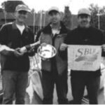 Doug Axtell is holding the silver, center, with friends Don Boesel, at left, and Kermit Sleggs, right.