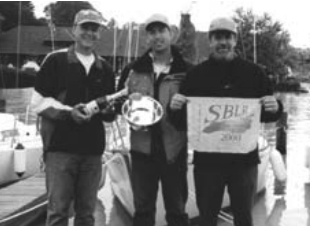 Doug Axtell is holding the silver, center, with friends Don Boesel, at left, and Kermit Sleggs, right.