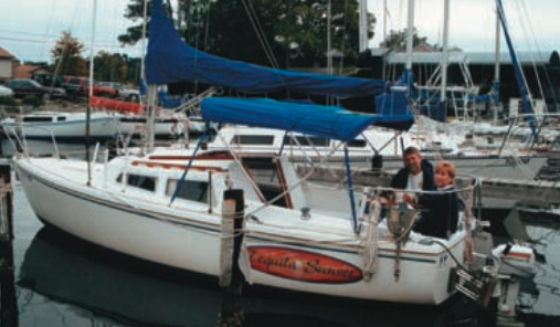 Bob and Trish aboard Tequila Sunset in their slip at Fort Walton Beach Yacht Club.
