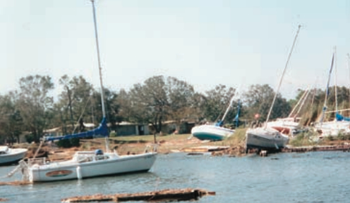 Tequila Sunset rode out Hurricane Opal successfully, though she was blown out of her slip. One line kept her from blowing ashore like the two dozen boats in the surrounding slips.