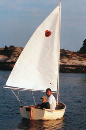 Nephew Stephen sails the Fatty Knees in Dix Harbor, Maine, with a proud Scott as crew.