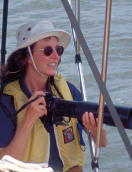 Picture of a woman with a camera on a boat