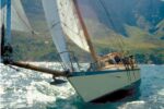 Cooee under sail among the Great Barrier Reef islands.