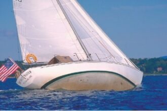 Secret Water sails at some unknown degree of heel. Ted notes that some heeling allows CCA-style boats to pick up waterline length but, the editors who sailed with Art ask, must they show the entire bottom to do so?