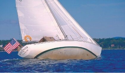 Secret Water sails at some unknown degree of heel. Ted notes that some heeling allows CCA-style boats to pick up waterline length but, the editors who sailed with Art ask, must they show the entire bottom to do so?