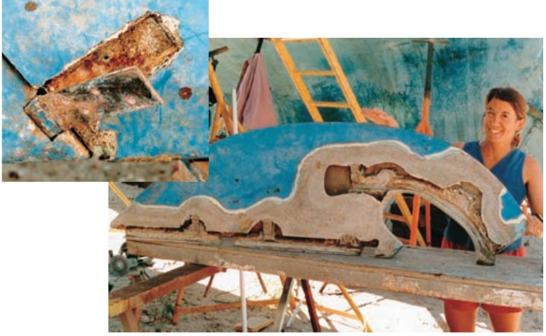 A corroded and unsalvageable hinge, at left. Melissa inspects the empty rudder shell, at right, after chiseling out the bronze shafts for inspection.