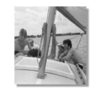 At left, Brian Klock and author Glen Smith enjoy a summer day on Es Mia in 1973. Center, aboard Es Mia on Lake Ponchatrain: Kenny Hughes, owners Nat and Ann Klock, and the author. At right, Charlie Allen in front with half of Brian Klock (we love these old amateur photos!), Kenny Hughes, and author Glen Smith.
