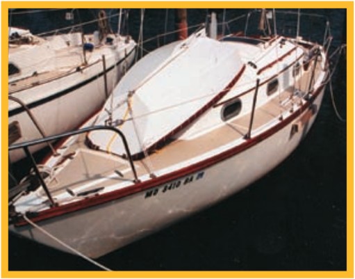 Bruce Barber built his stitch-n-glue (actually drywall screw-n-tape) pram to fit on the foredeck of the 25D. He notes that the lashed-on gunwhale cusioning is pipe insulation in a Sunbrella sleeve.