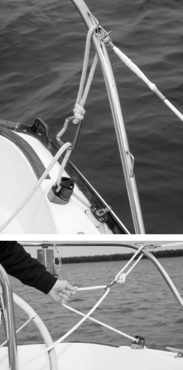 Photo at left above shows the control line and cleat and the caribiner that eases the release and prevents premature recleating. Photo at left shows how a flick of the wrist sets up the vang/preventer.
