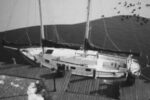 Mid-winter photo of the author’s schooner, Delphinus, at the dock next to his home in New Jersey. His boat is protected from ice around the hull by a water-agitation motor.