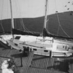 Mid-winter photo of the author’s schooner, Delphinus, at the dock next to his home in New Jersey. His boat is protected from ice around the hull by a water-agitation motor.