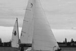 Ted’s former Nimble, purchased when prices were right. (She was so new, in fact, that he hadn’t gotten around to sewing snaps on the mizzen for the ensign, as he discusses in the January issue.)