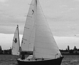 Ted’s former Nimble, purchased when prices were right. (She was so new, in fact, that he hadn’t gotten around to sewing snaps on the mizzen for the ensign, as he discusses in the January issue.)