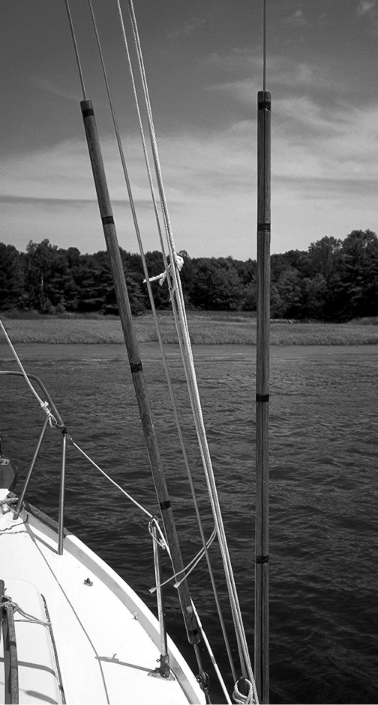 Shroud rollers to protect standing rigging and lifelines and the sails and sheets which come into contact with them can be made of bamboo or oak, such as the ones pictured here, or from PVC plumbing pipe at a fraction of the cost.