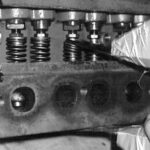Adjust the jaws open just wide enough to fit over the valve spring and at a slight angle so that when the spring is compressed, they will be parallel.