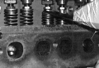 Adjust the jaws open just wide enough to fit over the valve spring and at a slight angle so that when the spring is compressed, they will be parallel.