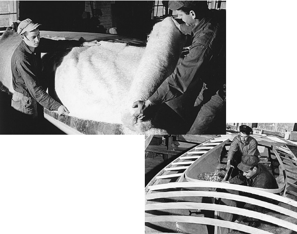 First produced in 1947, the Rebel was originally built with a fiberglass hull and wood deck. The hull was about 1/4-inch thick on the bottom and 3/16-inch thick at the gunwale. These photos, taken in June 1949, show a Rebel hull being laid up over a male wooden mold. After the hull was finished, it was turned right side up and the deck installed (above). At right above, having installed the deck beams, carpenters Arthur Laytart and Robert Ellison work on the centerboard trunk. In 1954, the decks were converted to fiberglass.