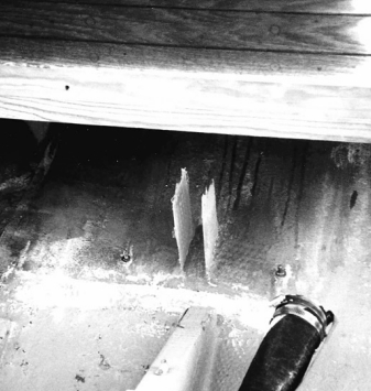 A total secondary bond failure. This builder tabbed uncoated wood beams to the hull without any prep, mechanical fasteners, or fillets.