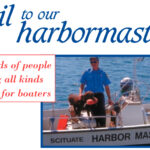 Sean Kelly, assistant harbormaster, and his furry assistant, named Bear, are at the ready in Scituate, Mass.