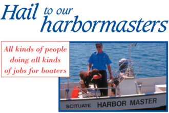 Sean Kelly, assistant harbormaster, and his furry assistant, named Bear, are at the ready in Scituate, Mass.
