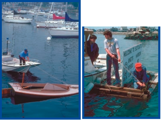 Assistant harbormaster Joe Noble, at left, tends a boat whose seams are being swelled following launch in Scituate, Mass. Welcome to Scituate Harbor, at right, but make no wake. Harbormaster staffmembers set the speed sign.