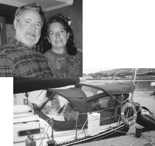 Aubrey and Judy aboard Veleda, at left, and the full cockpit enclosure they have appreciated so much, below.