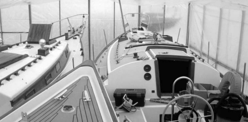 Gleaming hulls invite attention inside a protected covering when winter months put the charter season on hold.