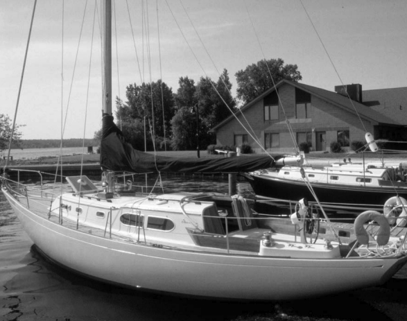 The Apache 37, Tomahawk, awaits charter, with the John Alden-designed Fuji 35, bobbing gently in the background.