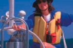 Picture of a woman sailing in a life vest