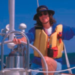 Picture of a woman sailing in a life vest