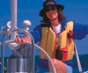 Picture of a woman sailing in a life vest