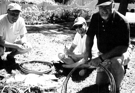 The project begins. In the photo at left, Bill, in foreground, enlists the talents and muscles of his son-in-law, John Cross, at left, and son, Chip Sandifer, in the middle.