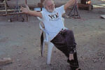 Picture of a man sitting in a boatyard